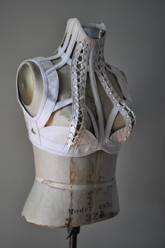 Off-white faux-vintage corset neckbrace with boning and lacing, front view